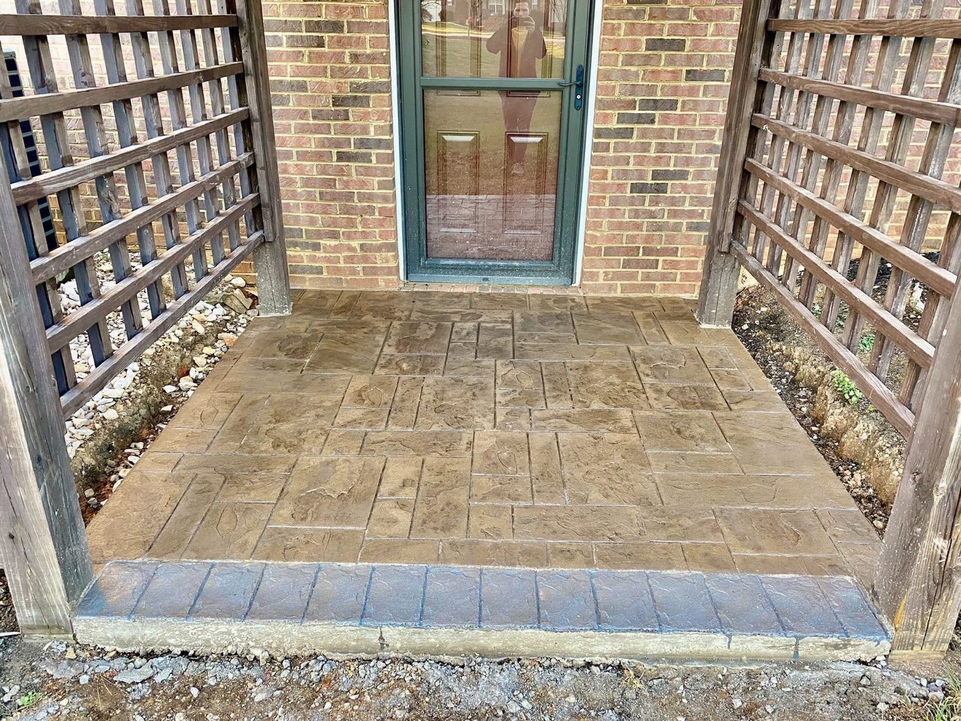 Tan ashlar stamped concrete entry landing